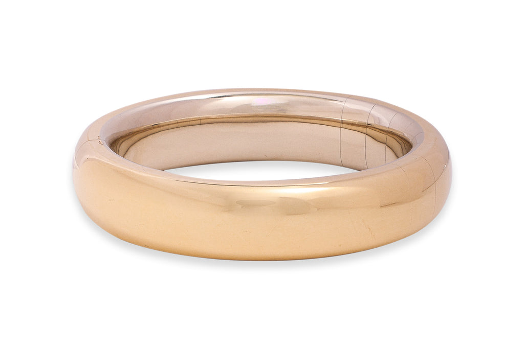 A LARGE GOLD BANGLE BY POMELLATO