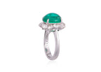 A ZAMBIAN EMERALD AND DIAMOND 'HALO' RING