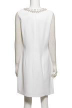 GIVENCHY - A WHITE SLEEVELESS DRESS WITH FAUX PEARL EMBELLISHMENT