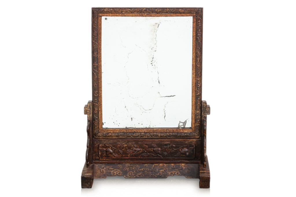 A CARVED HARDWOOD TABLE MIRROR