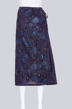 Y'S YOHJI YAMAMOTO - A PURPLE FLORAL WRAP SKIRT WITH BLUE METALLIC PRINT ACCENTS