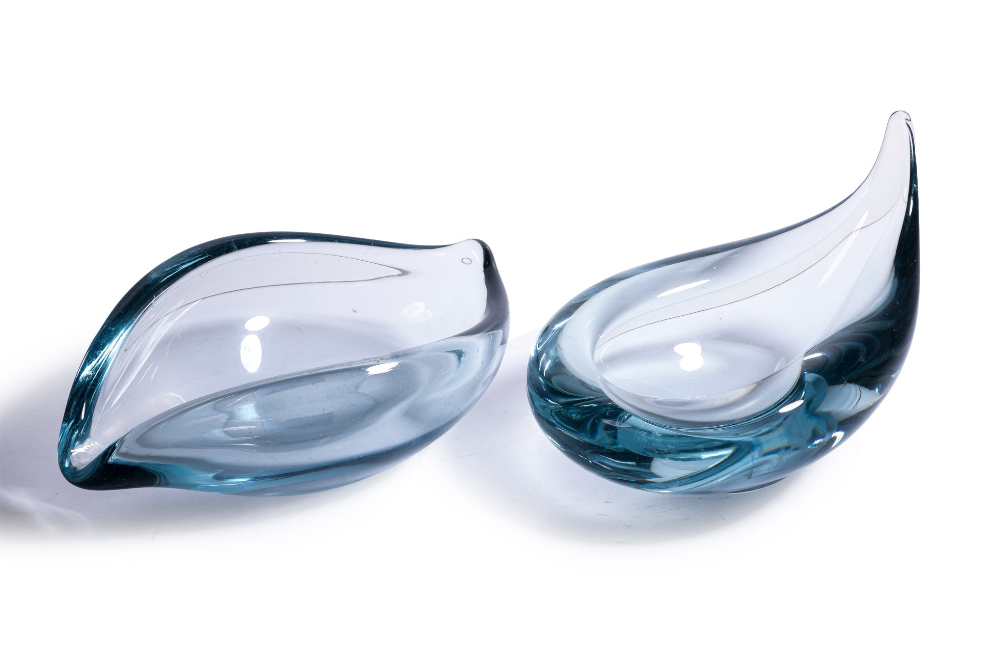 A GROUP OF SEVEN HOLMEGAARD BLUE GLASS BOWLS AND DISHES