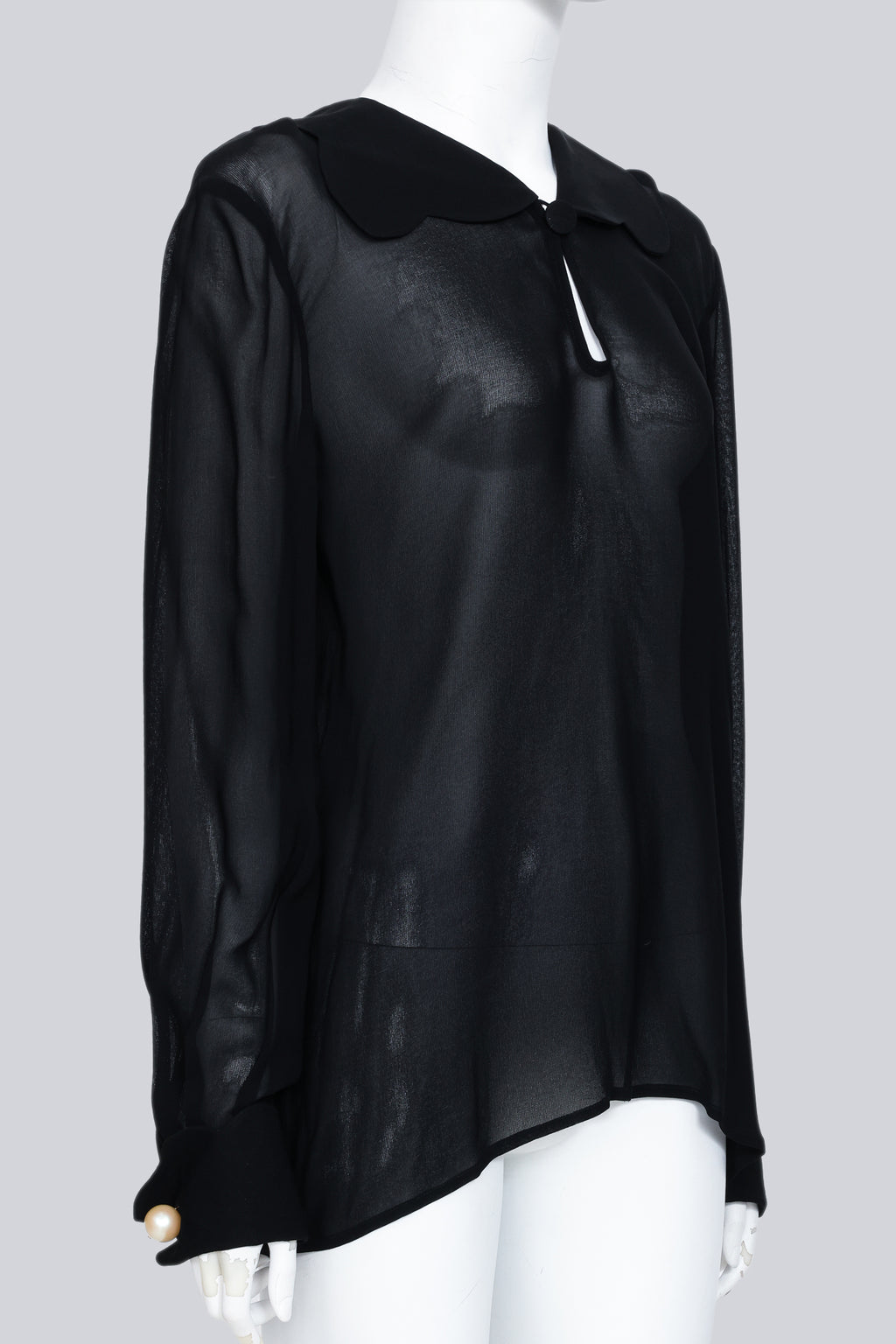 VALENTINO - A BLACK SHEER COLLARED BLOUSE WITH FAUX PEARL CUFF BUTTONS