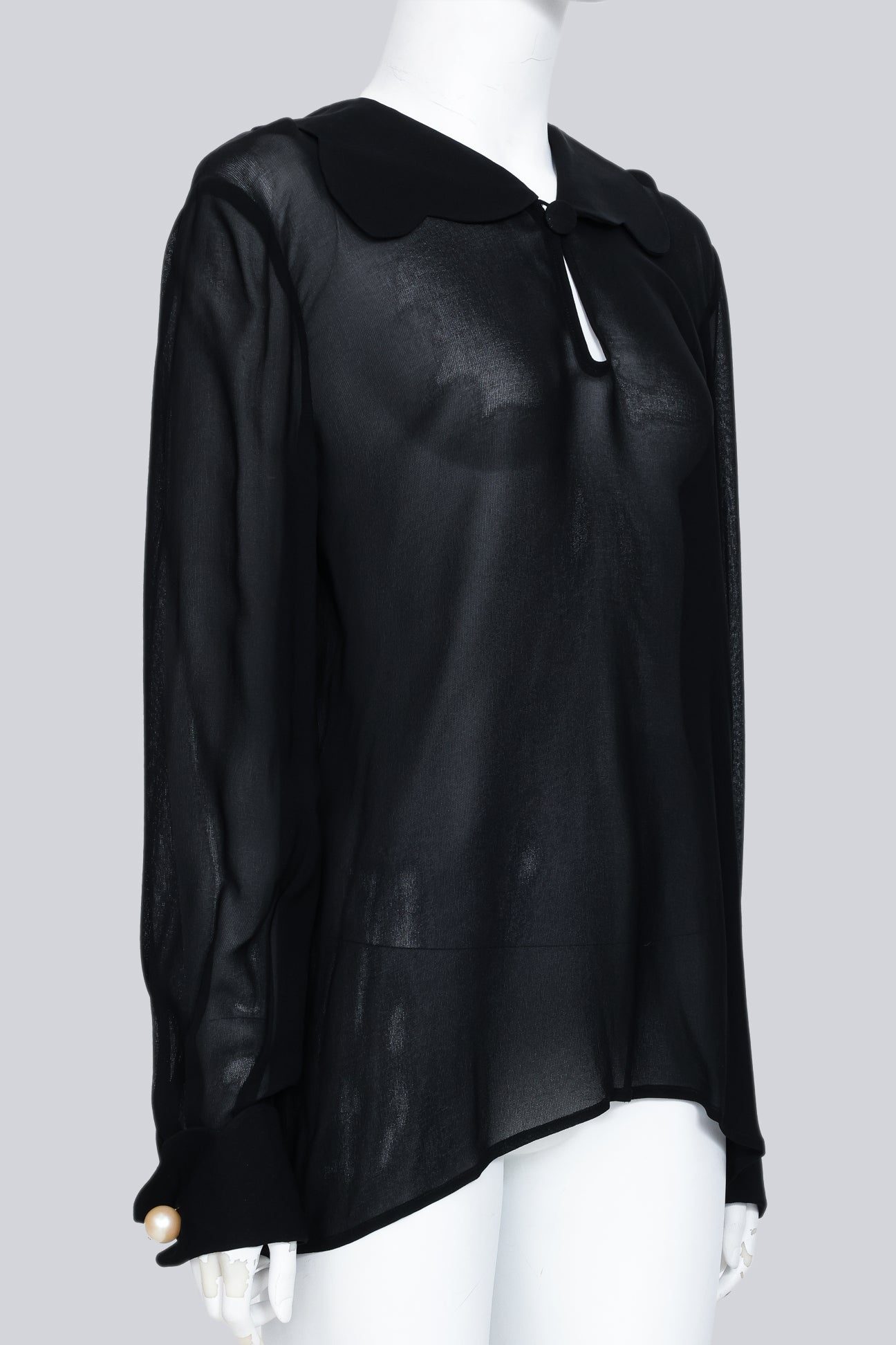 VALENTINO - A BLACK SHEER COLLARED BLOUSE WITH FAUX PEARL CUFF BUTTONS