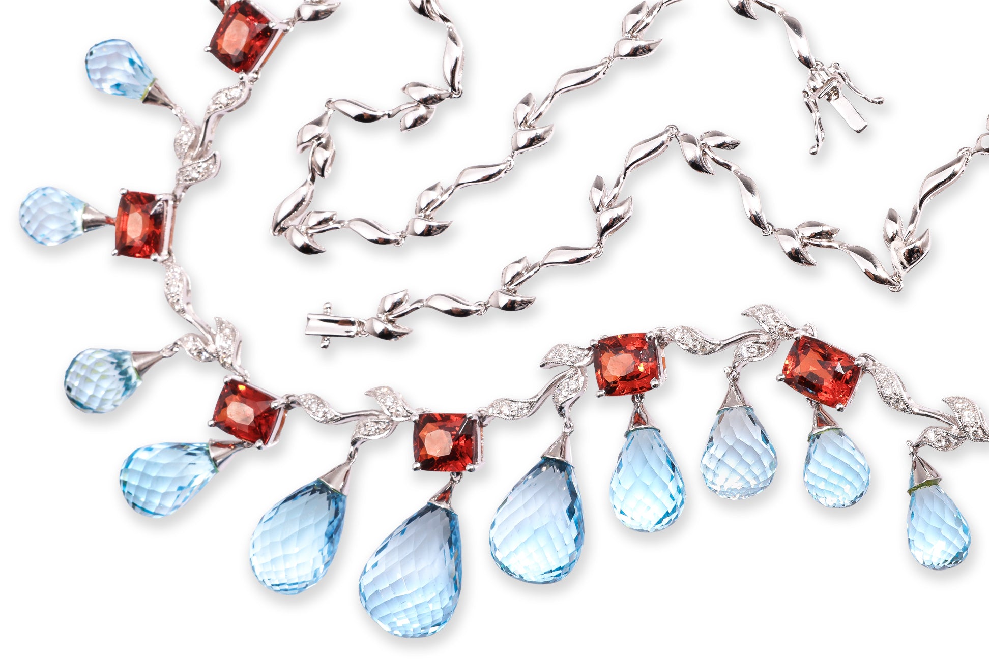 A BLUE TOPAZ, GARNET AND DIAMOND NECKLACE