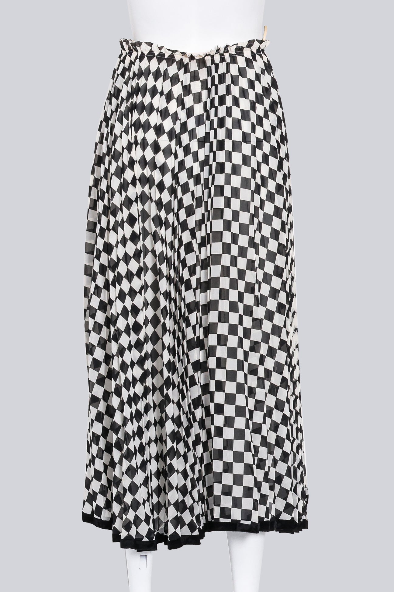 COMME DES GARCONS - A BLACK AND WHITE CHECKERED SKIRT