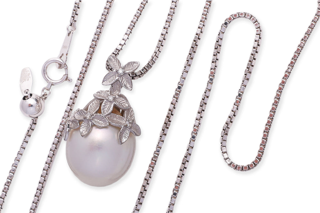 A SOUTH SEA CULTURED PEARL AND DIAMOND PENDANT ON CHAIN