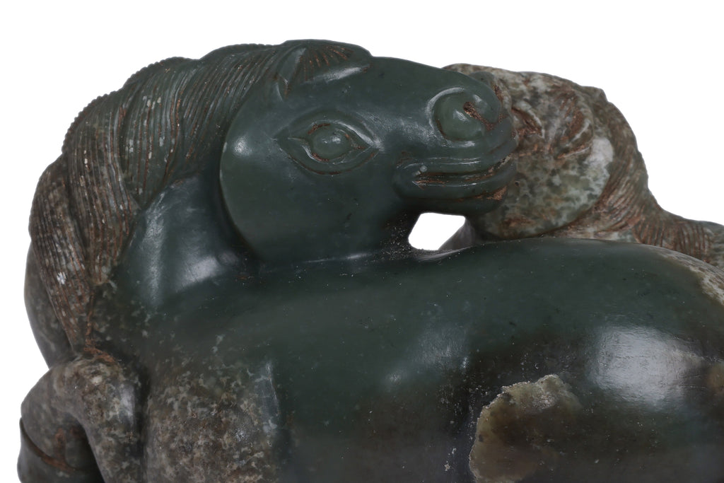 A CARVED GREEN JADE HORSES GROUP