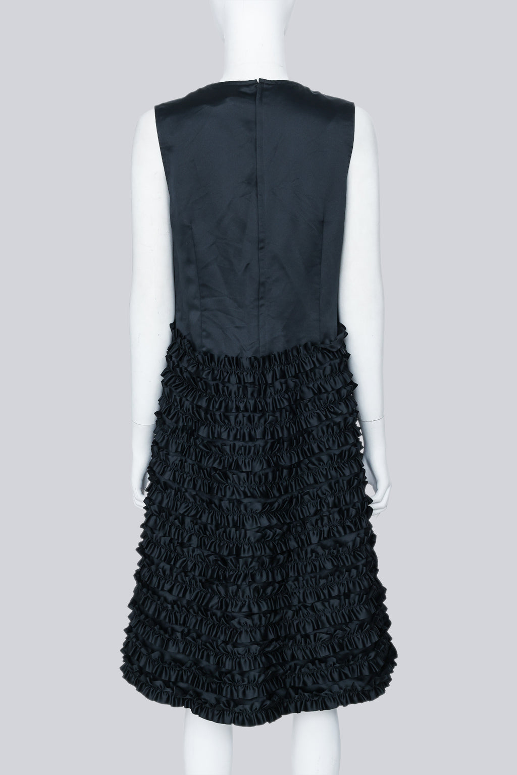 COMME DES GARÇONS - A BLACK SLEEVELESS DRESS WITH RUFFLED SKIRT
