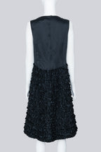 COMME DES GARÇONS - A BLACK SLEEVELESS DRESS WITH RUFFLED SKIRT