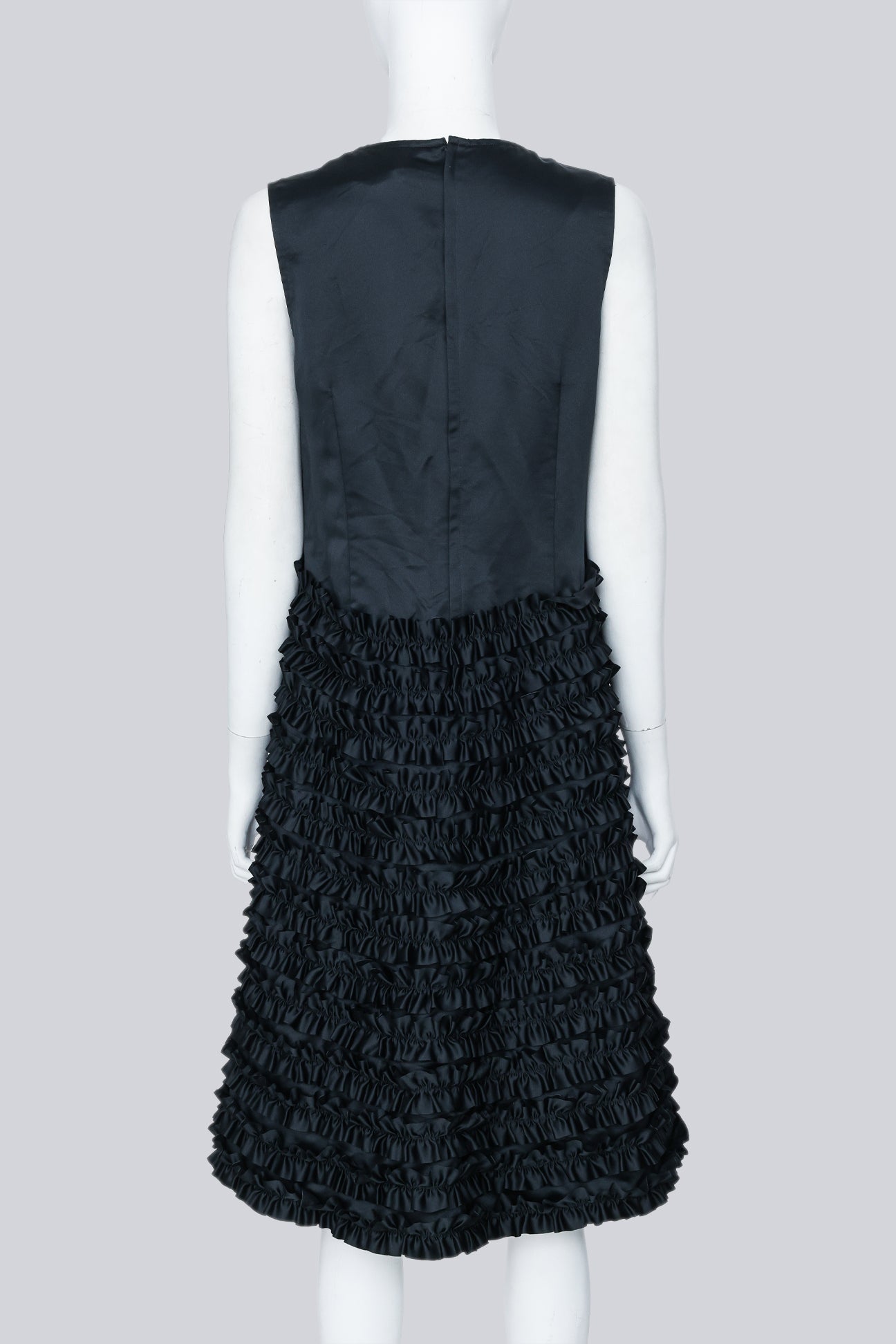 COMME DES GARÇONS - A BLACK SLEEVELESS DRESS WITH RUFFLED SKIRT