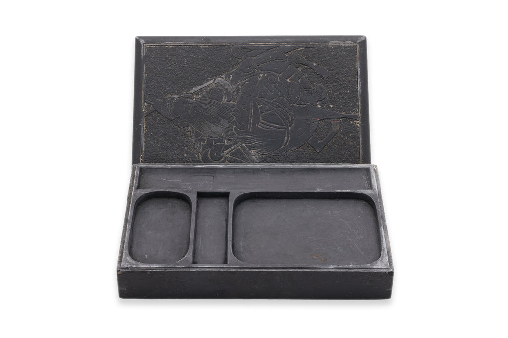 A INK STONE WITH CARVED GUANDI TO COVER