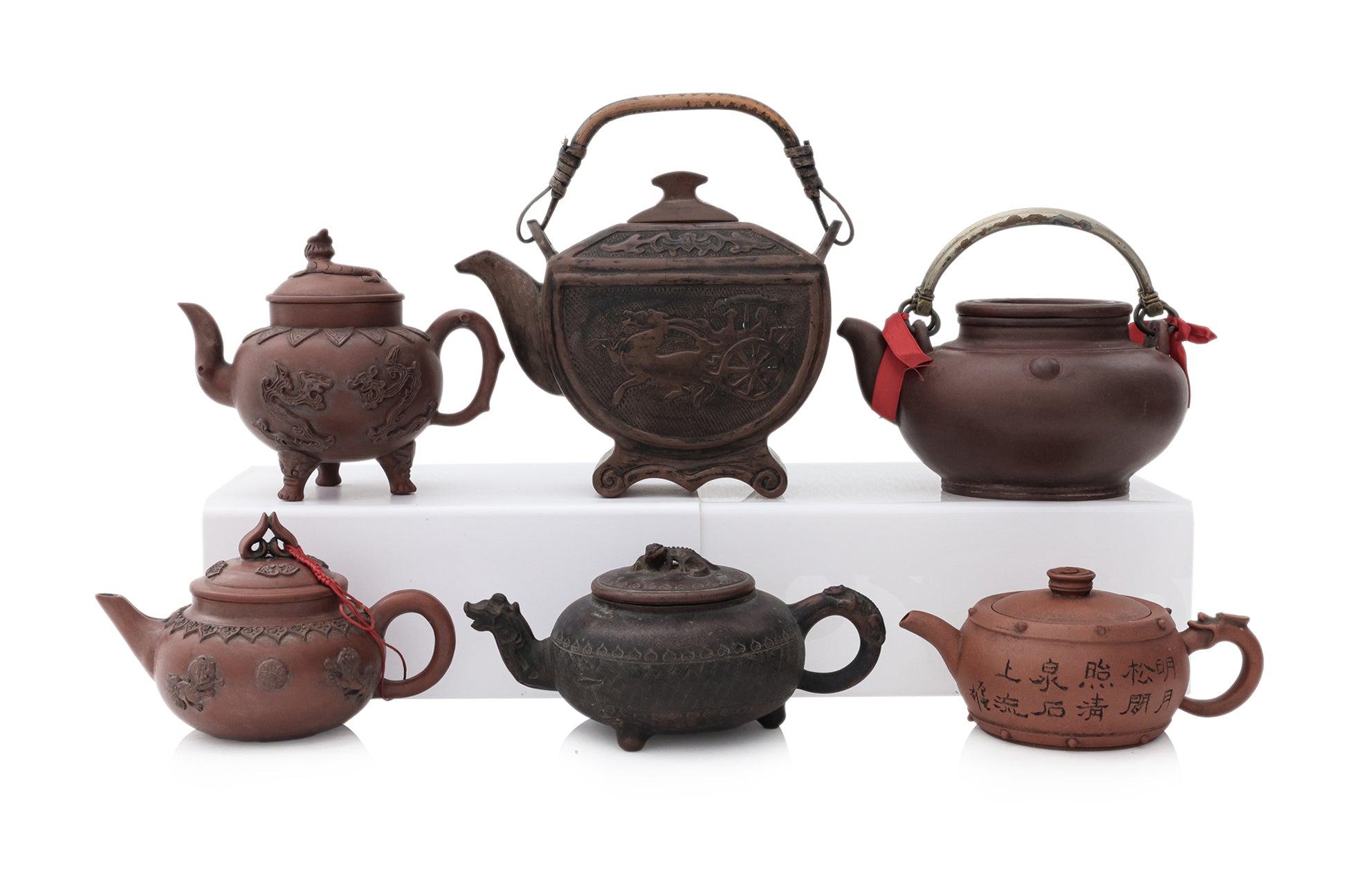 A GROUP OF SIX YIXING ZISHA POTTERY TEAPOTS