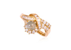 A CAT'S EYE CHRYSOBERYL AND DIAMOND RING