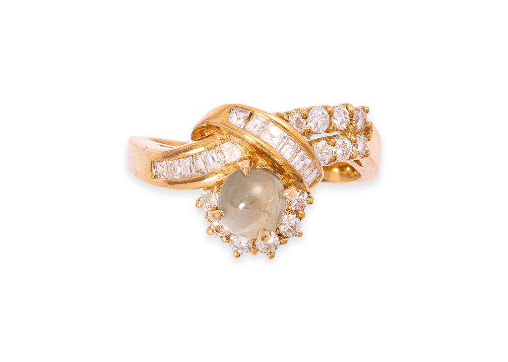 A CAT'S EYE CHRYSOBERYL AND DIAMOND RING