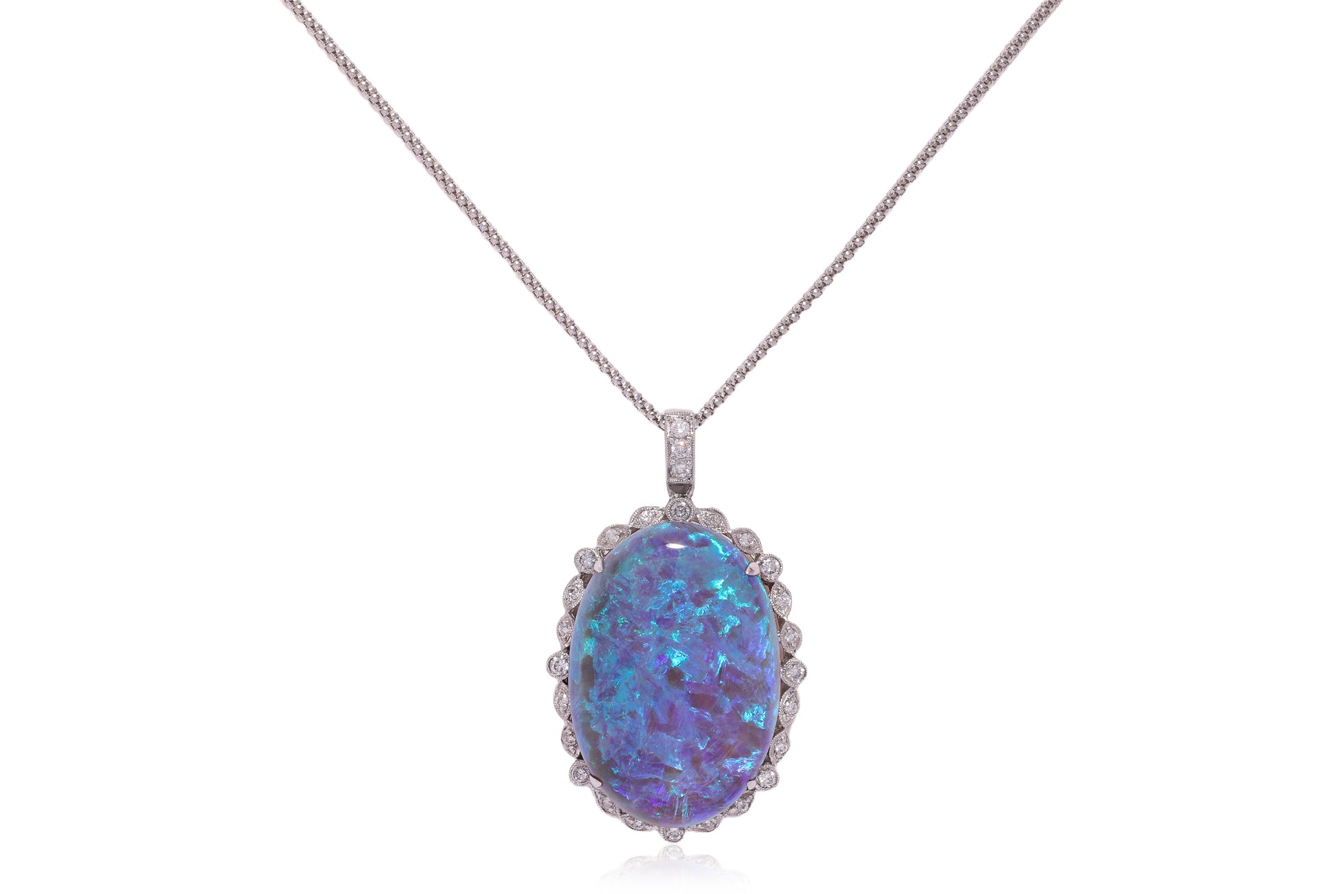A LARGE OPAL AND DIAMOND PENDANT ON CHAIN