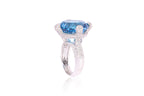 A BLUE TOPAZ AND DIAMOND RING