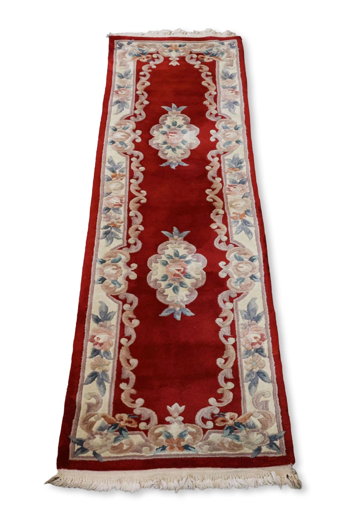 A CHINESE RED FLORAL WOOL HALL RUNNER (69 X 244CM)