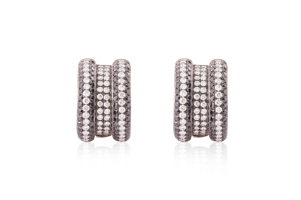 A PAIR OF DIAMOND AND BLACK DIAMOND EARRINGS