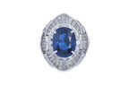 A SAPPHIRE AND DIAMOND CLUSTER RING