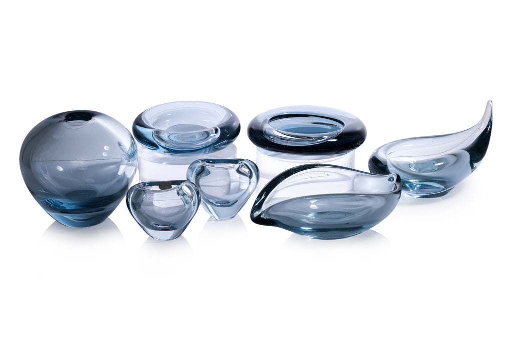 A GROUP OF SEVEN HOLMEGAARD BLUE GLASS BOWLS AND DISHES