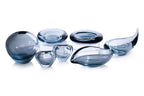 A GROUP OF SEVEN HOLMEGAARD BLUE GLASS BOWLS AND DISHES