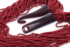 A MULTI-STRAND RED CORAL BEAD NECKLACE