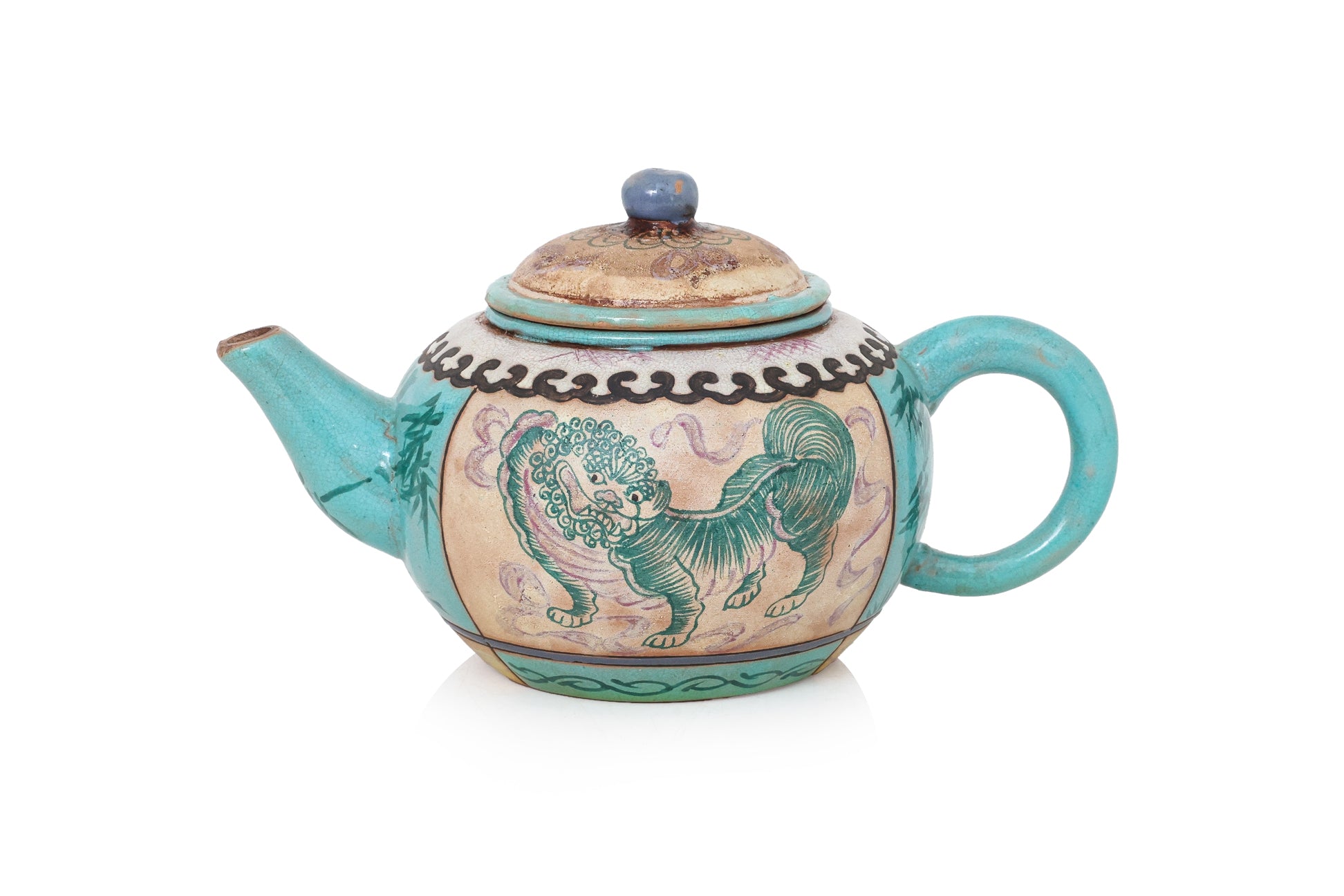 AN ENAMELLED POTTERY TEAPOT AND COVER