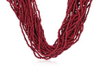 A MULTI-STRAND RED CORAL BEAD NECKLACE