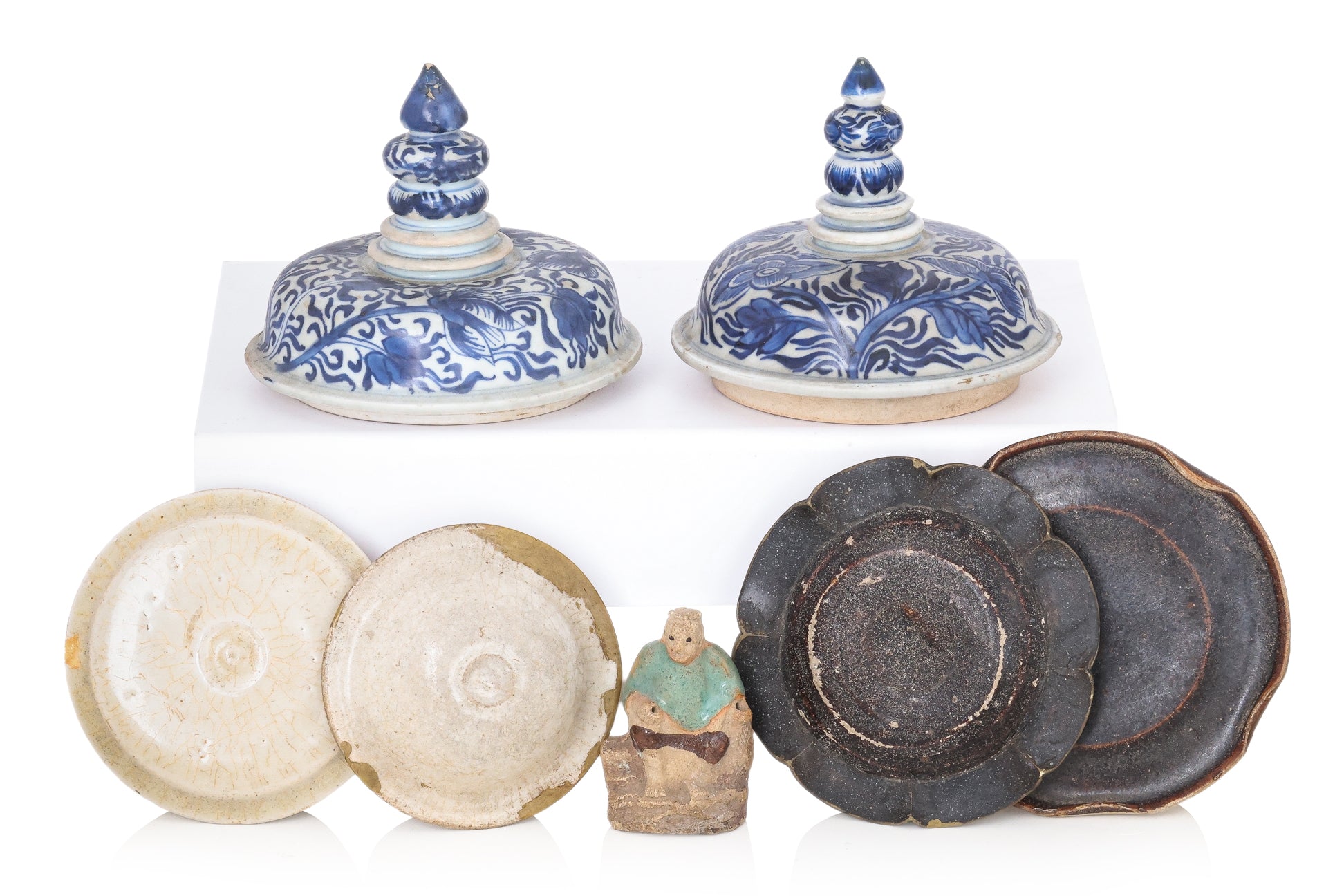 A GROUP OF SIX COVERS AND A SMALL STATUE