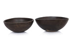 A GRADUATED PAIR OF LARGE WOODEN BOWLS BY CALVIN KLEIN
