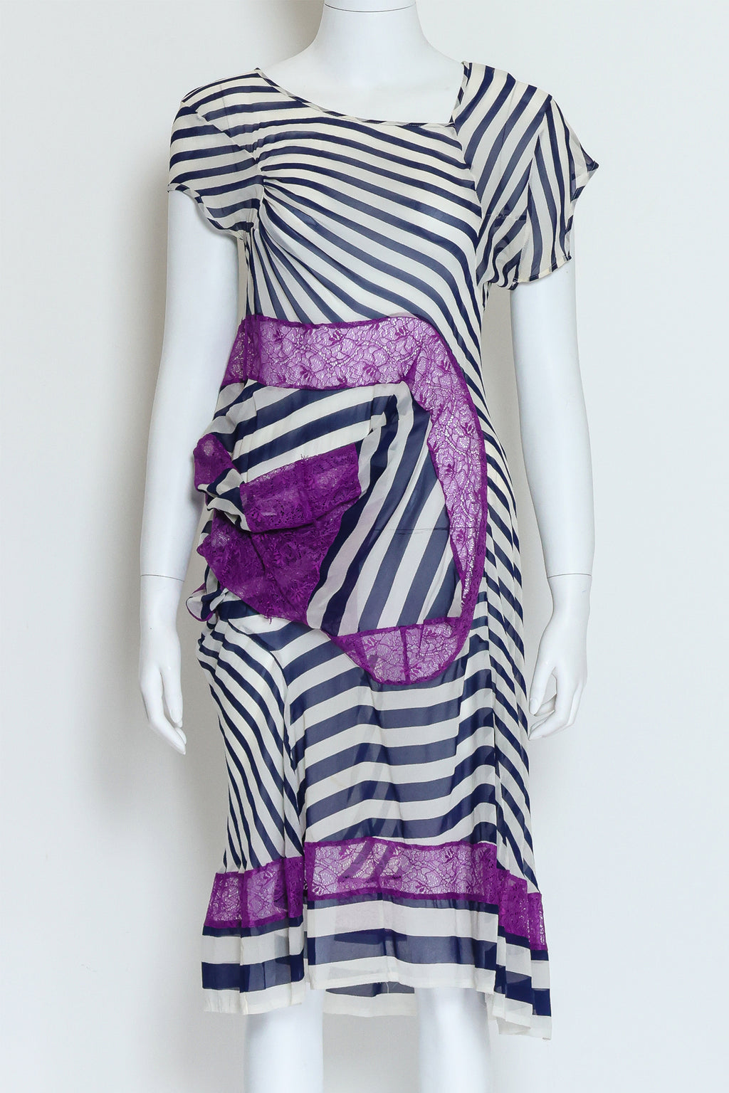 JUNYA WATANABE COMME DES GARÇONS – A BLACK AND WHITE STRIPED DRESS WITH PURPLE LACE