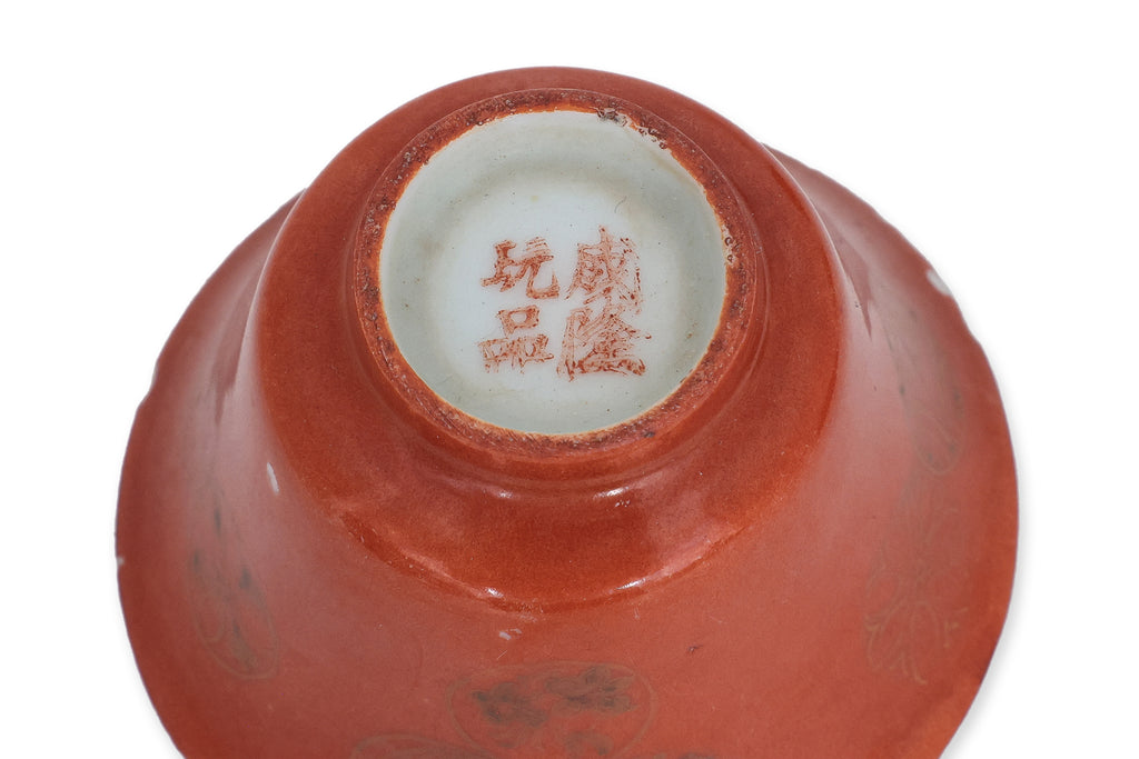 TWO SMALL CORAL GROUND TEA BOWLS WITH COVERS AND SAUCERS