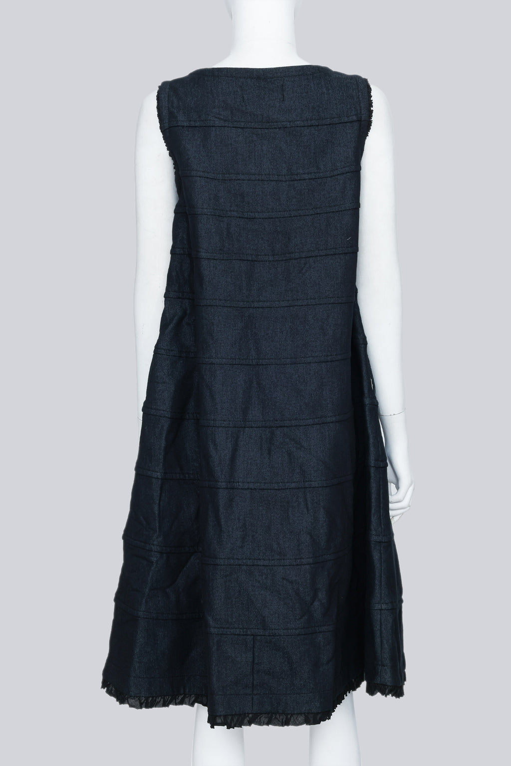 COMME DES GARÇONS TRICOT - A SLEEVELESS BLACK PANELLED DRESS WITH RUFFLED TRIM