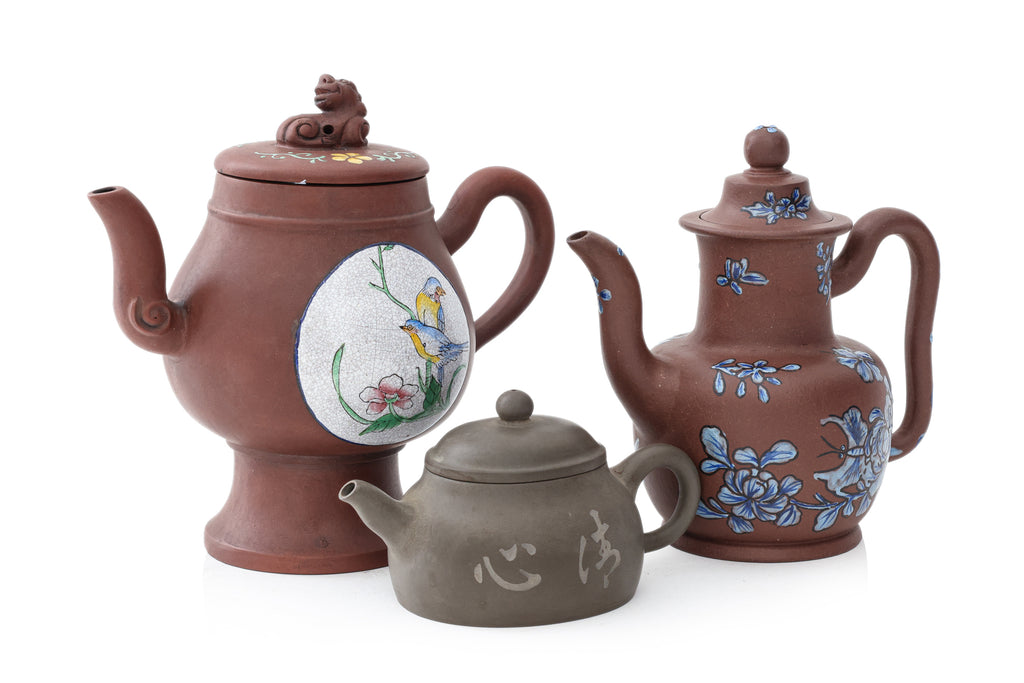 A GROUP OF THREE ENAMELLED YIXING ZISHA TEAPOTS