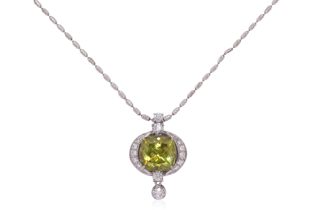 A SPHENE AND DIAMOND PENDANT ON CHAIN