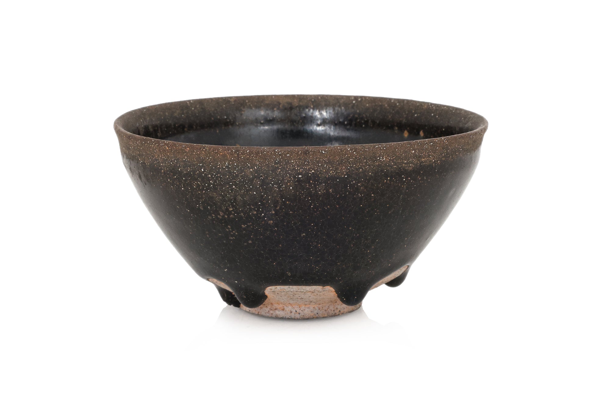 A BLACK GLAZED STONEWARE BOWL