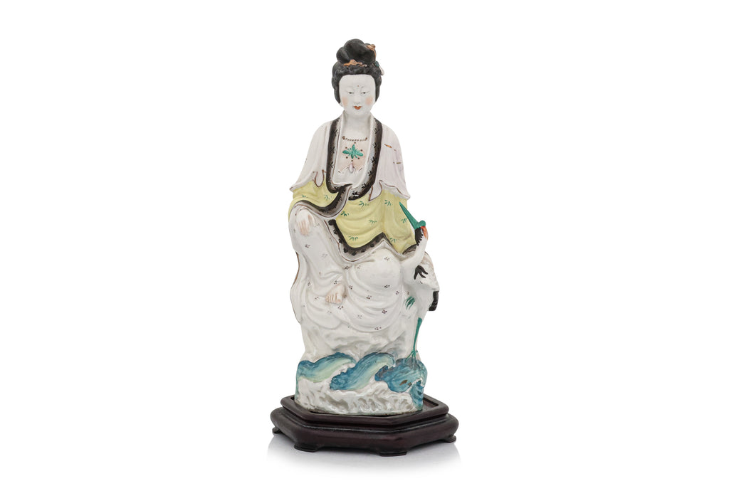 A POLYCHROME-ENAMELLED PORCELAIN FIGURE OF A WOMAN AND BIRD