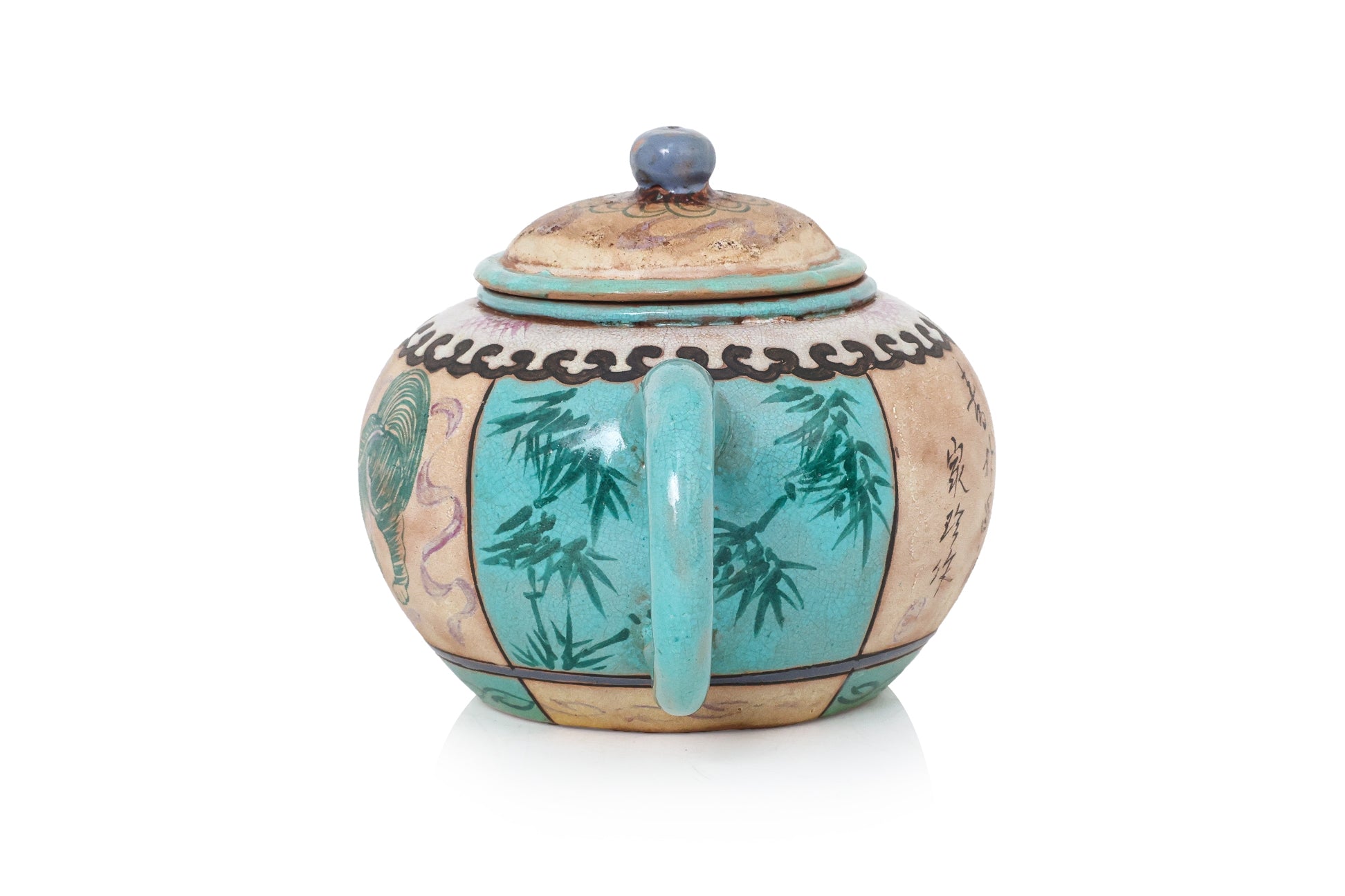 AN ENAMELLED POTTERY TEAPOT AND COVER