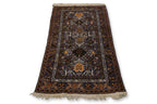 A CAUCASIAN WOOL RUG (200 X 110CM)